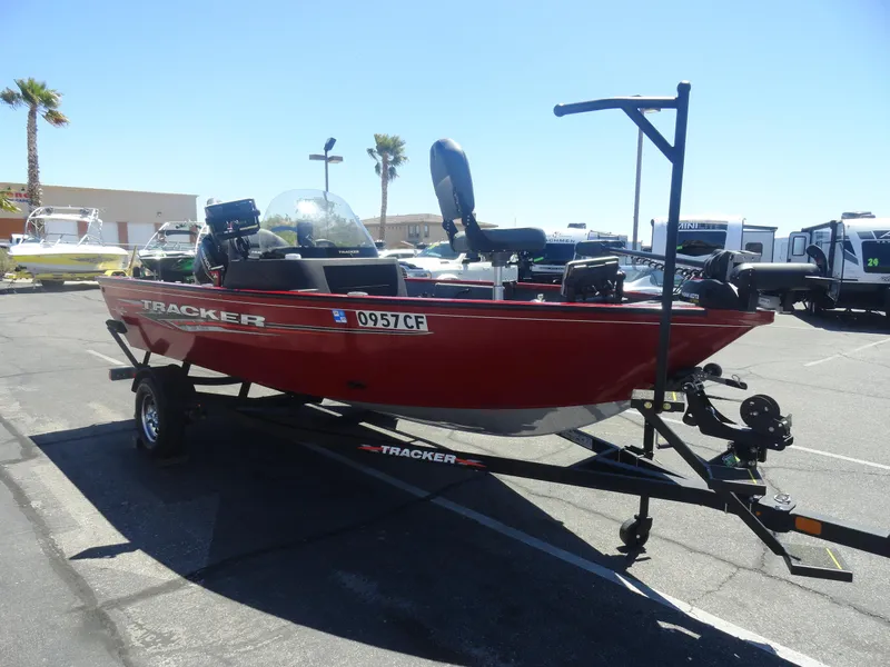Slide: The Image of 2024 Tracker Pro Guide V-16 SC boat on trailer in parking lot. - 6