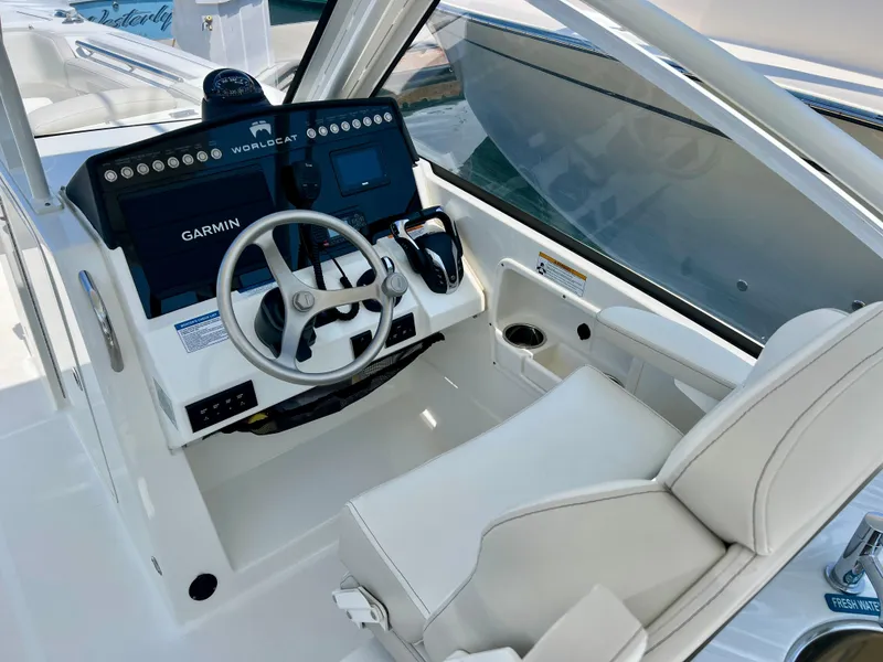 Slide: The Image of 2024 World Cat 280DC-x helm with Garmin navigation and white seating. - 14