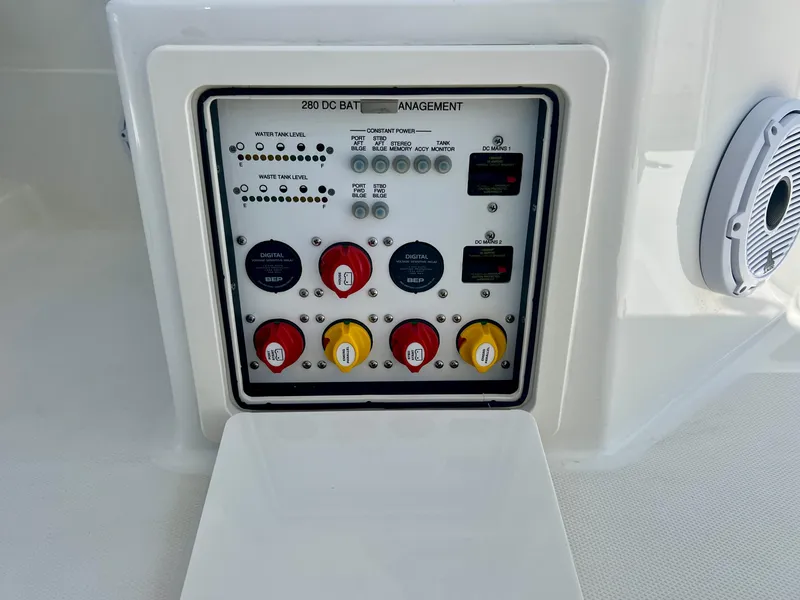 Slide: The Image of 2024 World Cat 280DC-x battery management panel with switches and indicators. - 26