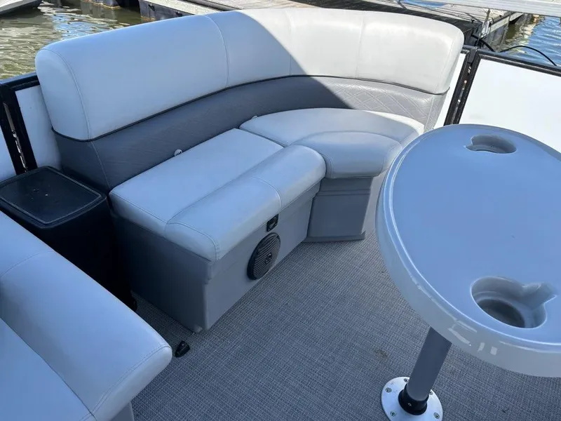 Slide: The Image of 2020 Bentley Pontoons LE 180 Cruise interior with gray seating and table. - 7