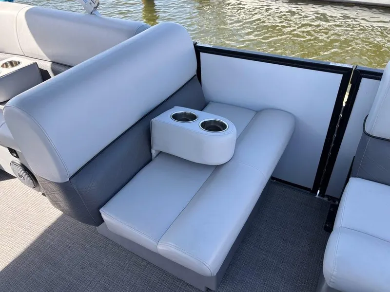 Slide: The Image of 2020 Bentley Pontoons LE 180 Cruise interior seating with cup holders on a boat. - 8