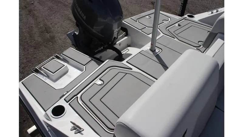 Slide: The Image of 2025 Starcraft SV 16 OB boat deck with seating and storage compartments. - 5