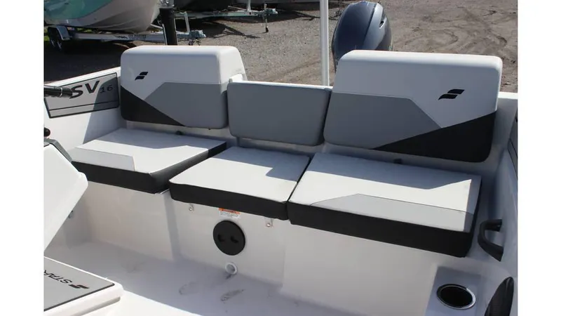 Slide: The Image of 2025 Starcraft SV 16 OB boat interior with gray and black cushioned seating. - 7