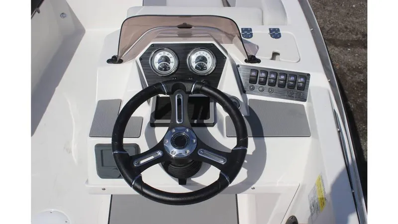 Slide: The Image of Steering console of 2025 Starcraft SV 16 OB boat with gauges and controls. - 9