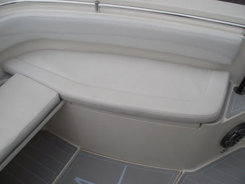 Slide: The Image of 2021 Cobia 301 Center Console boat interior seating with light upholstery. - 14