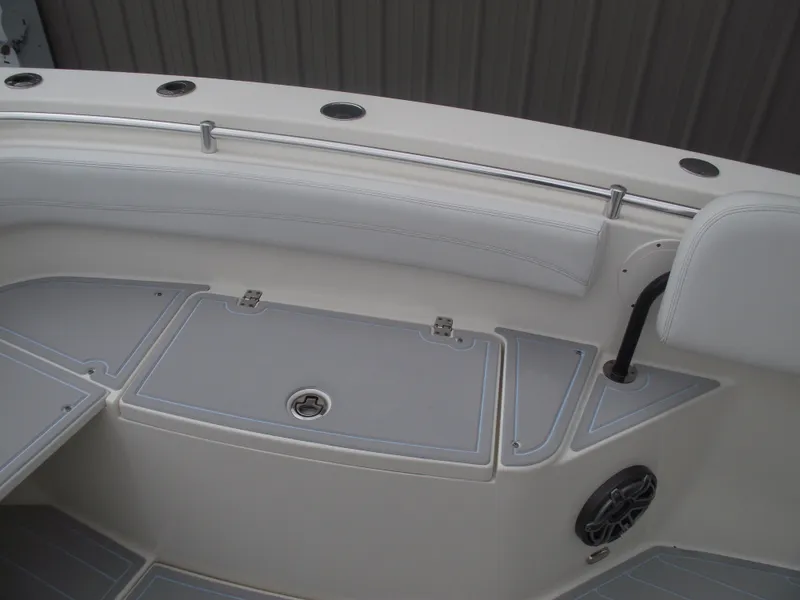 Slide: The Image of 2021 Cobia 301 Center Console boat interior with seating and storage compartments. - 15