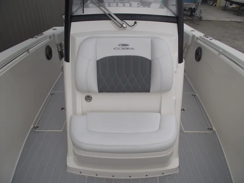 Slide: The Image of 2021 Cobia 301 Center Console boat interior with cushioned seating. - 18