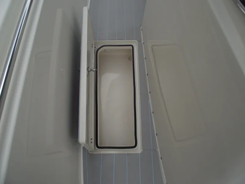 Slide: The Image of Storage compartment on 2021 Cobia 301 Center Console boat interior. - 28