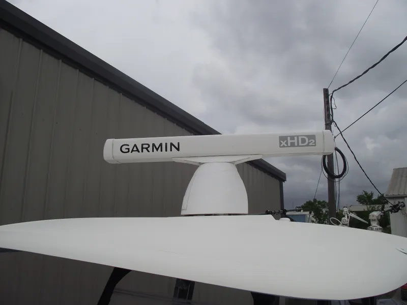 Slide: The Image of Garmin xHD2 radar on 2021 Cobia 301 Center Console boat under cloudy sky. - 32