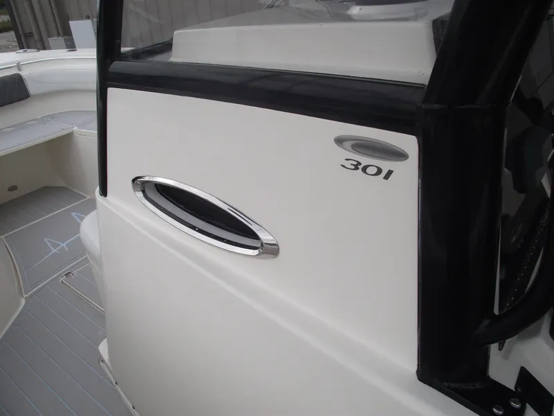 Slide: The Image of 2021 Cobia 301 Center Console boat interior detail with sleek design elements. - 33