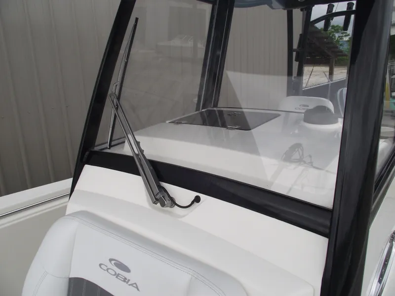 Slide: The Image of 2021 Cobia 301 Center Console boat with windshield and seating detail. - 34