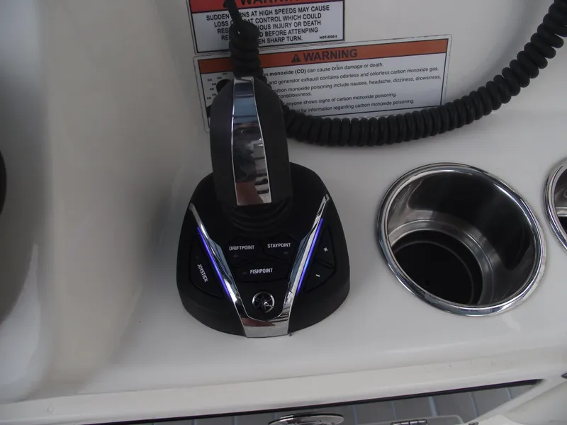 Slide: The Image of Joystick control on 2021 Cobia 301 Center Console boat dashboard. - 47