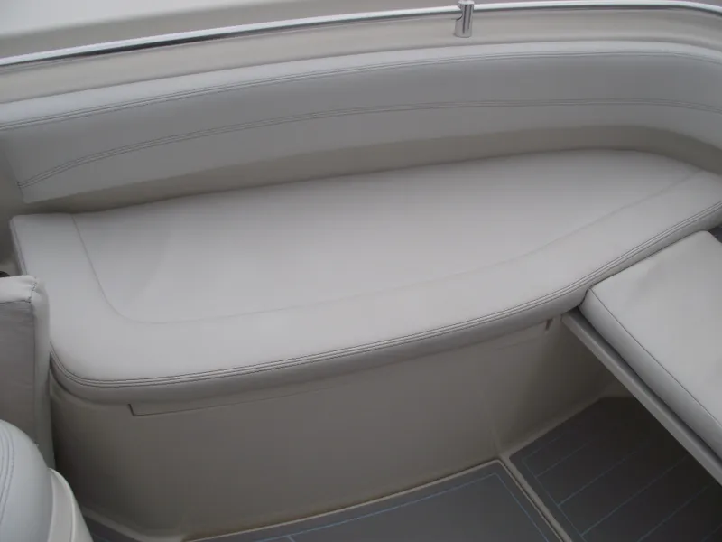 Slide: The Image of 2021 Cobia 301 Center Console boat interior with cushioned seating and sleek design. - 9