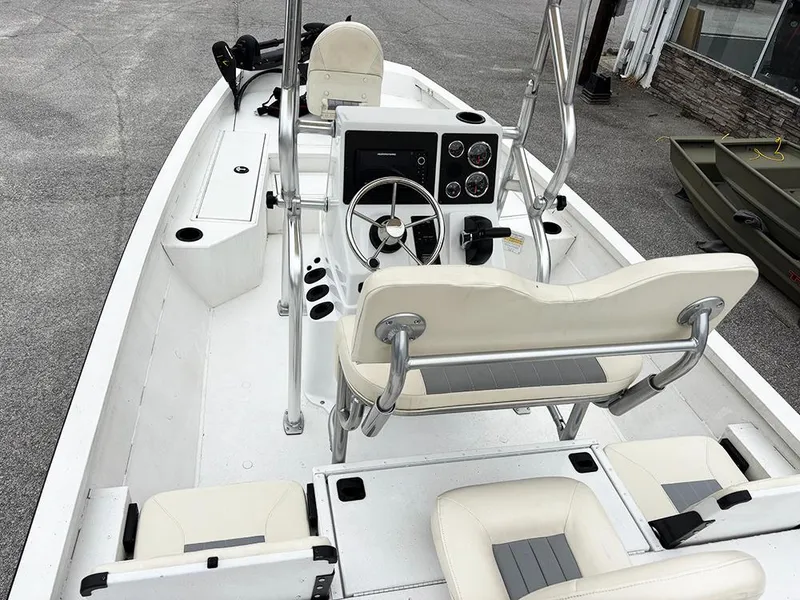 Slide: The Image of 2023 G3 Bay 18 GX boat interior with steering console and seating. - 10