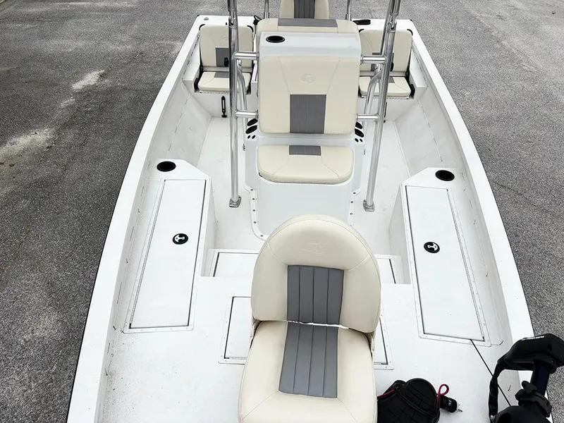 Slide: The Image of 2023 G3 Bay 18 GX boat interior with white and gray seating, spacious layout. - 11