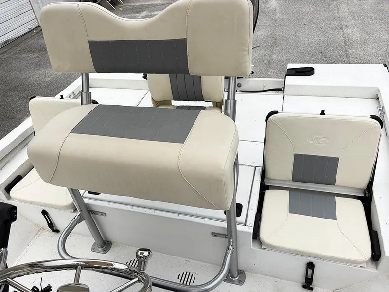Slide: The Image of 2023 G3 Bay 18 GX boat interior with beige and gray seating. - 24