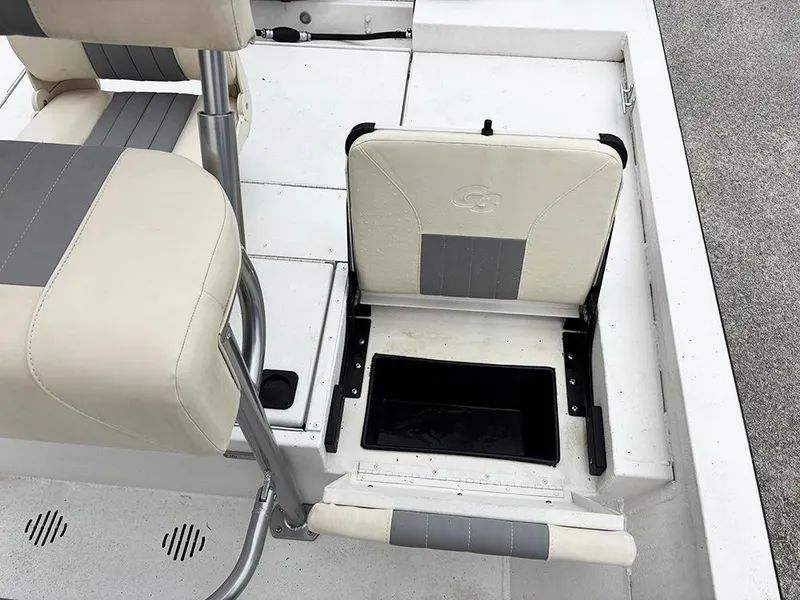 Slide: The Image of 2023 G3 Bay 18 GX boat interior with foldable seat and storage compartment. - 25