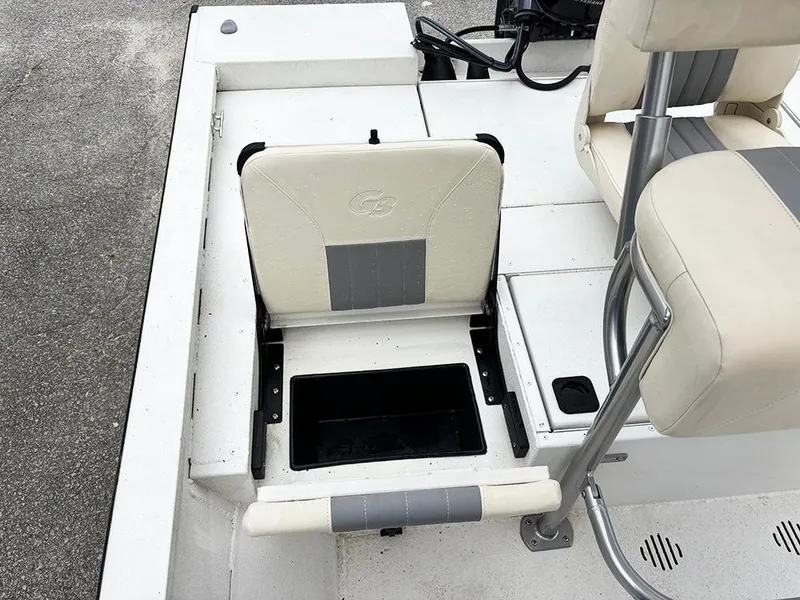 Slide: The Image of 2023 G3 Bay 18 GX boat seat with storage compartment open. - 26