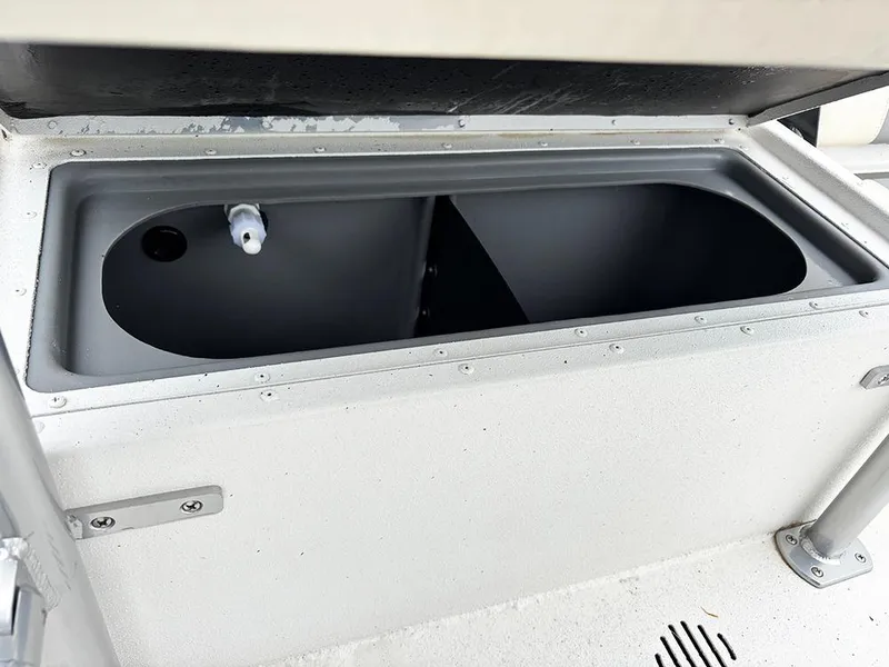 Slide: The Image of 2023 G3 Bay 18 GX boat storage compartment, open lid, gray interior. - 27