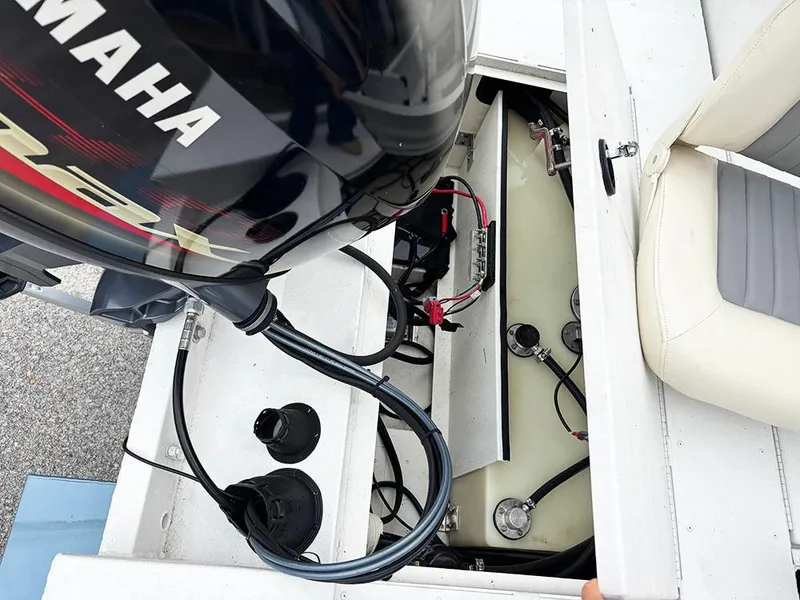 Slide: The Image of 2023 G3 Bay 18 GX boat engine compartment with Yamaha motor and wiring. - 30