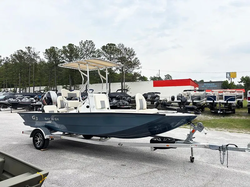 Slide: The Image of 2023 G3 Bay 18 GX boat on trailer in outdoor dealership lot. - 5