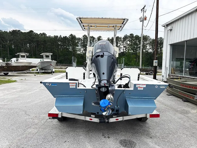 Slide: The Image of 2023 G3 Bay 18 GX boat on trailer, rear view, parked outdoors. - 8