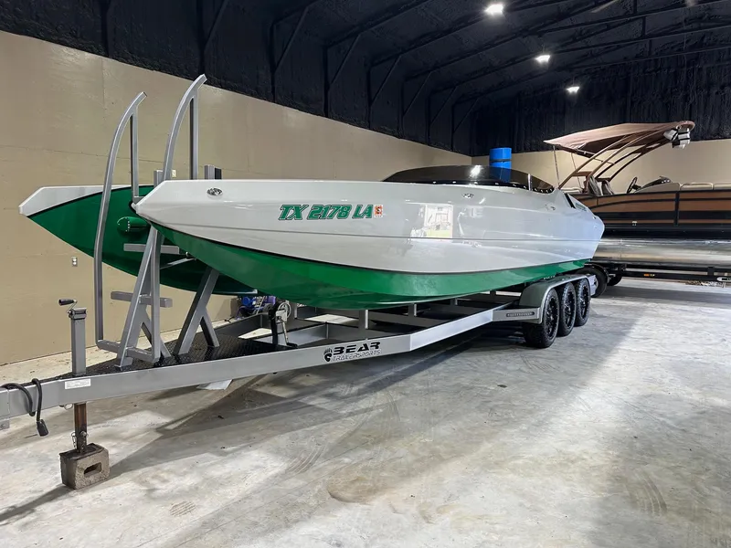 The Image of 2013 Howard 28 SCS boat on trailer in indoor storage facility. - 1