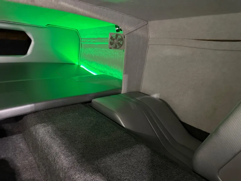 Slide: The Image of Interior of 2013 Howard 28 SCS boat with green ambient lighting. - 9