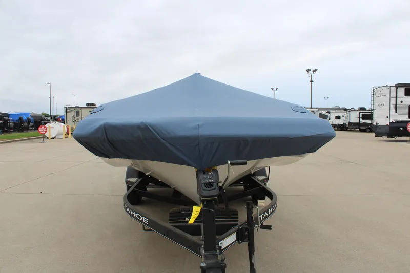 Slide: The Image of 2022 Tahoe 2150 boat with cover on trailer in parking lot. - 10