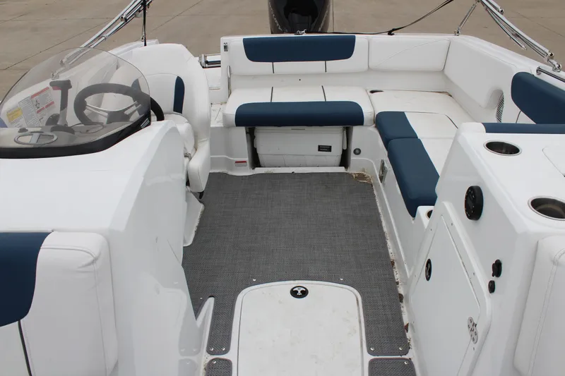 Slide: The Image of 2022 Tahoe 2150 boat interior with seating and steering wheel. - 24