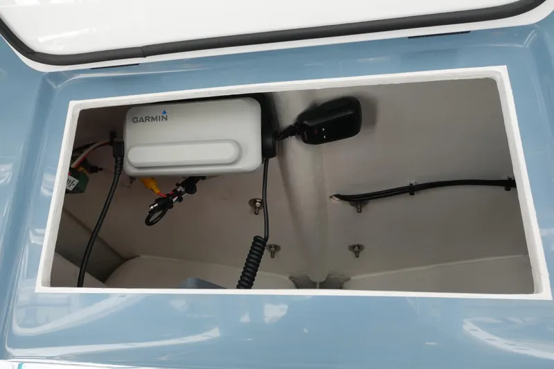 Slide: The Image of 2022 Cape Horn 34 XS boat compartment with Garmin electronics and wiring. - 24