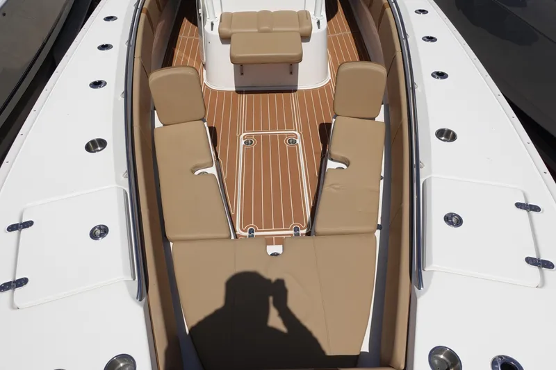 Slide: The Image of 2022 Cape Horn 34 XS boat interior with tan seating and wood-style flooring. - 29