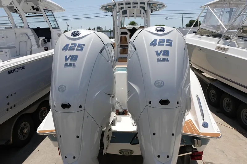 Slide: The Image of 2022 Cape Horn 34 XS with twin 425 V8 outboard engines, docked in a marina. - 41