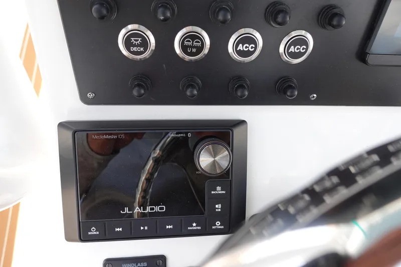 Slide: The Image of Control panel of 2022 Cape Horn 34 XS with JL Audio system and switches. - 17