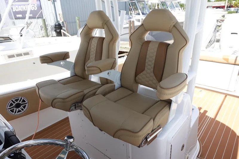 Slide: The Image of 2022 Cape Horn 34 XS boat with luxurious tan seating and modern design. - 19