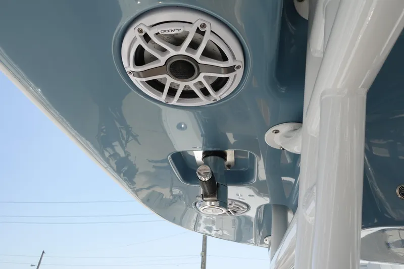 Slide: The Image of 2022 Cape Horn 34 XS boat with speakers and blue canopy. - 23