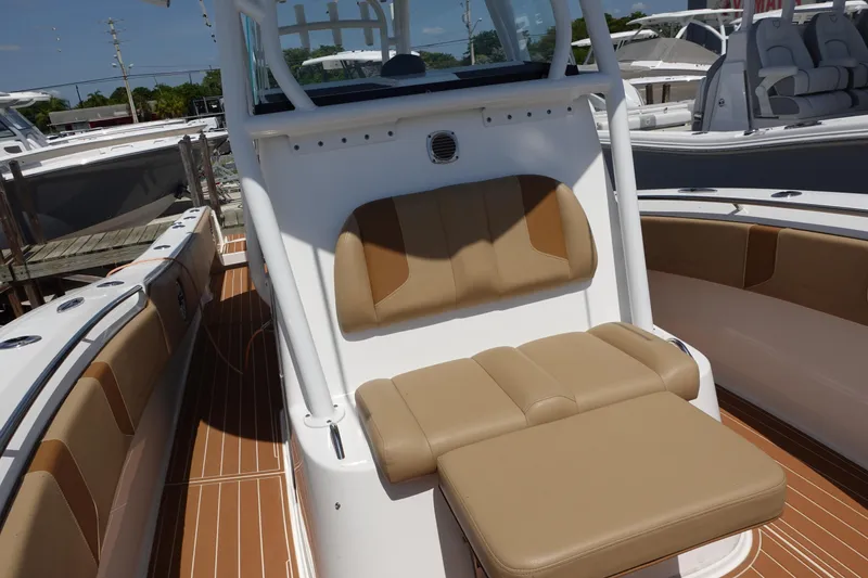 Slide: The Image of 2022 Cape Horn 34 XS boat interior with tan seating and white console. - 28