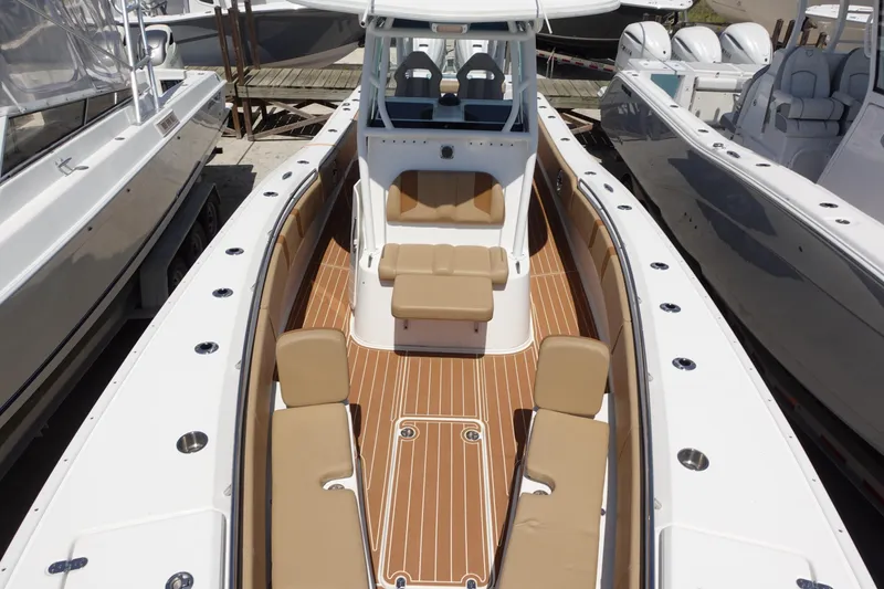 Slide: The Image of 2022 Cape Horn 34 XS boat with spacious deck and seating, docked at marina. - 30