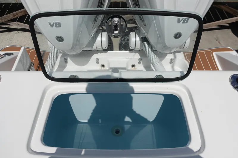 Slide: The Image of 2022 Cape Horn 34 XS boat with V8 engines and open storage compartment. - 34