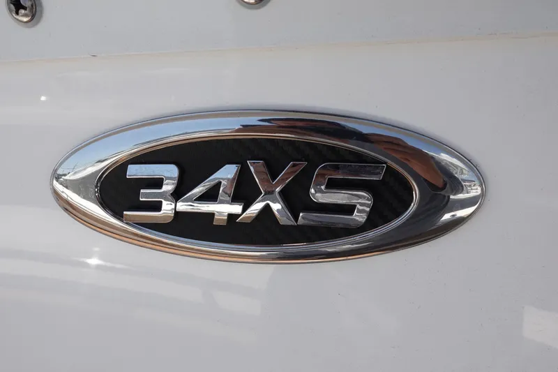 Slide: The Image of Chrome emblem of 2022 Cape Horn 34 XS boat model on white surface. - 39