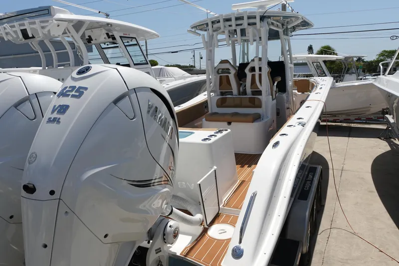 Slide: The Image of 2022 Cape Horn 34 XS boat with twin Yamaha 425 V8 engines, docked outdoors. - 44