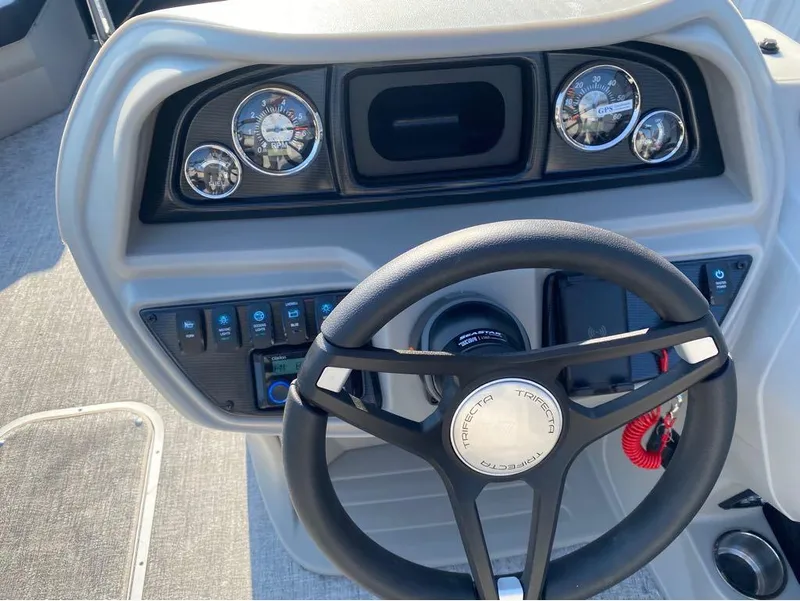 Slide: The Image of Steering wheel and dashboard of 2025 Trifecta 24 UL LE boat. - 16