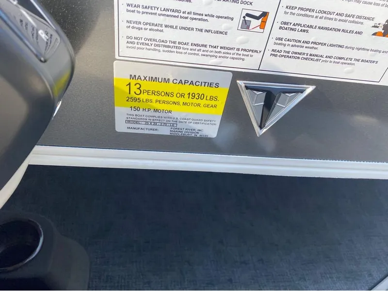 Slide: The Image of Capacity label on 2025 Trifecta 24 UL LE boat, max 13 people or 1930 lbs. - 25