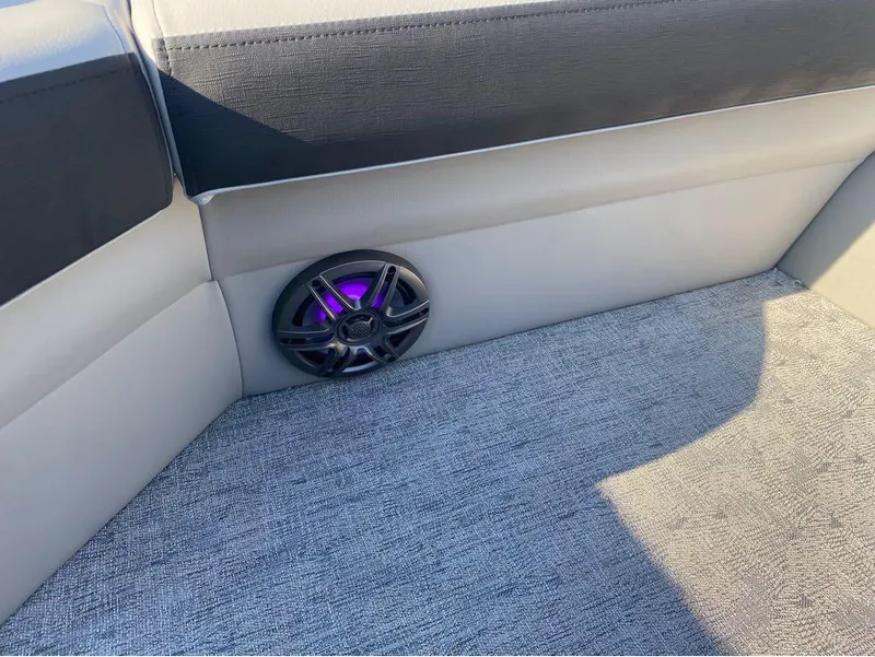 Slide: The Image of 2025 Trifecta 24 UL LE boat interior with speaker and gray upholstery. - 3