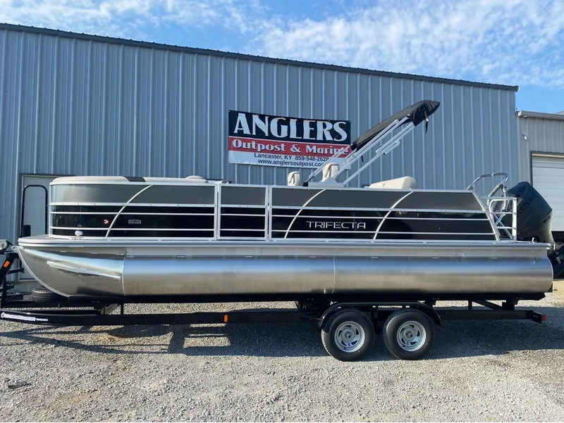 Slide: The Image of 2025 Trifecta 24 UL LE pontoon boat on trailer at Anglers Outpost & Marine. - 32