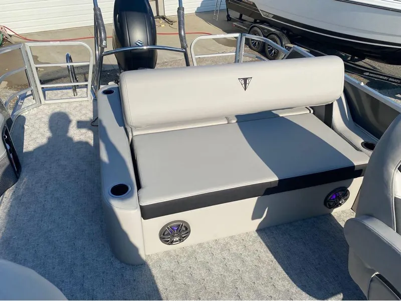 Slide: The Image of 2025 Trifecta 24 UL LE pontoon boat interior with cushioned seating and cup holders. - 33