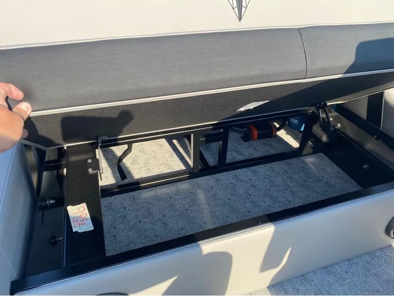 Slide: The Image of Open storage compartment in 2025 Trifecta 24 UL LE boat, showcasing interior space. - 46