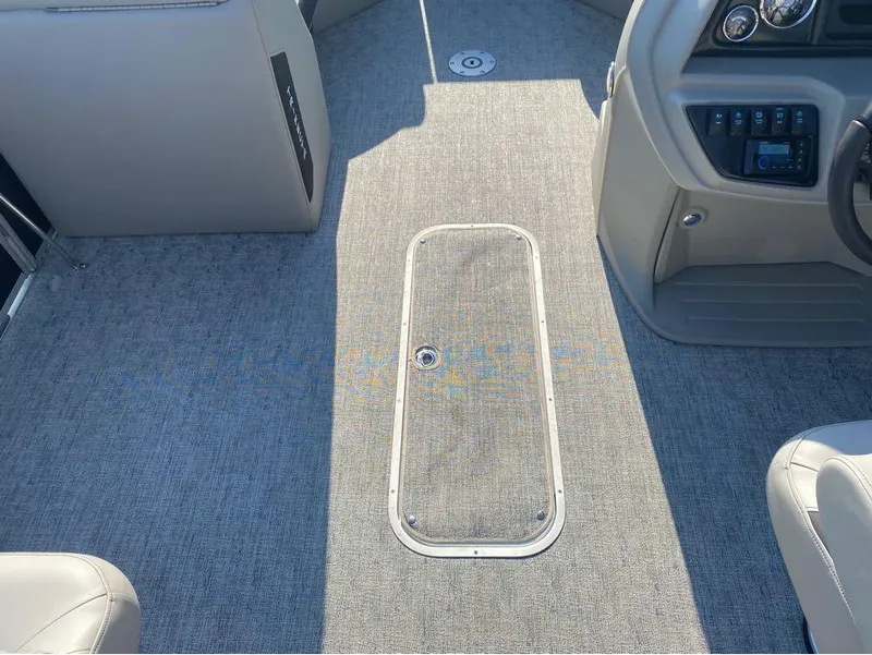Slide: The Image of Interior of 2025 Trifecta 24 UL LE boat with gray carpet and control panel. - 6
