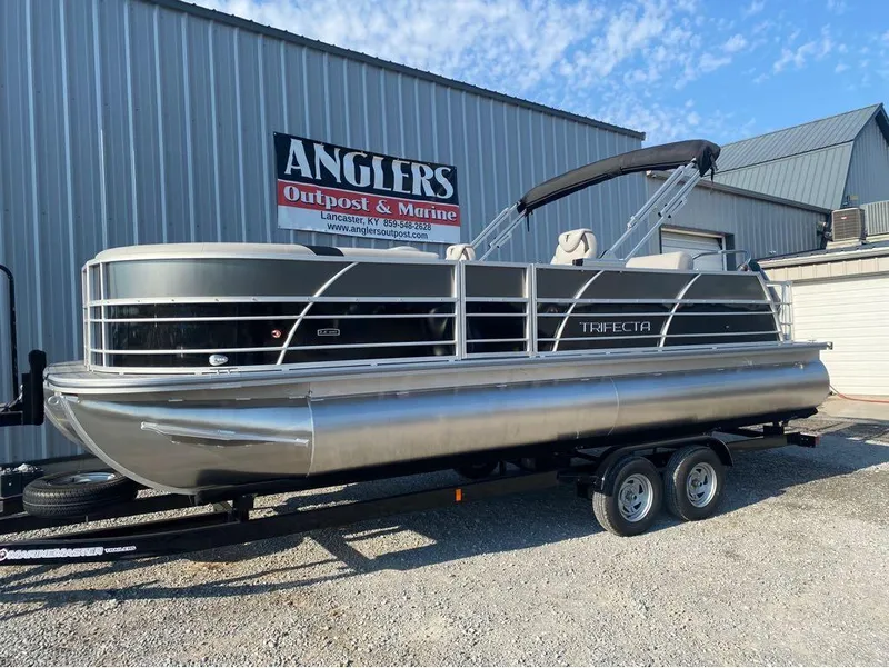 Slide: The Image of 2025 Trifecta 24 UL LE pontoon boat on trailer at Anglers Outpost & Marine. - 7
