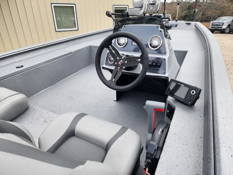 Slide: The Image of 2024 Xpress XP200 Catfish boat interior with steering wheel and navigation equipment. - 7
